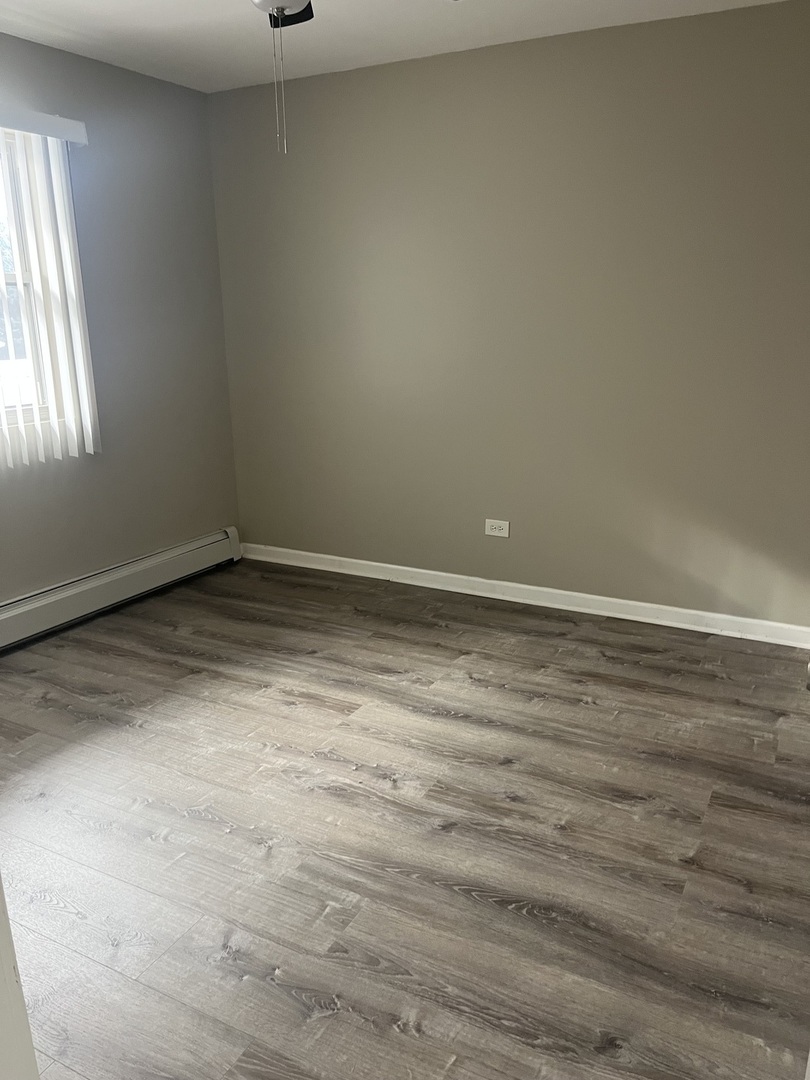 7501 SW Highway, Unit 5 Worth, IL 60482 - Photo 6 of 7 a view of empty room with window