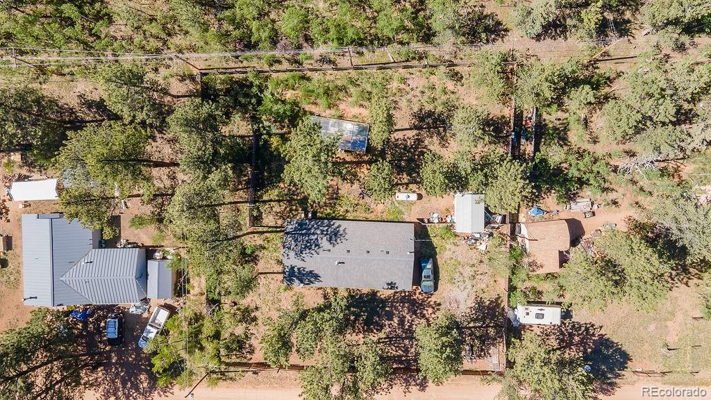 154 Cowan Road Bailey, CO 80421 - Photo 1 of 30 an aerial view of a house with a yard
