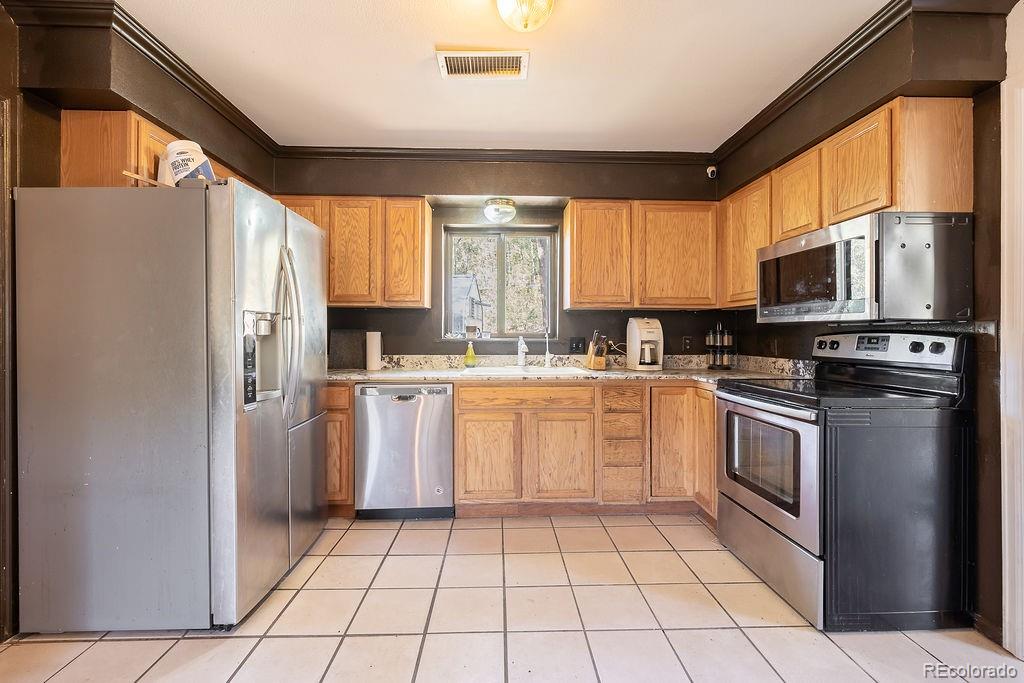 154 Cowan Road Bailey, CO 80421 - Photo 11 of 30 a kitchen with appliances cabinets and a sink