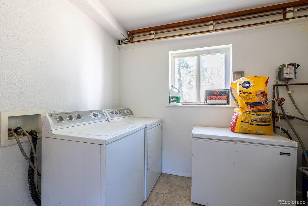154 Cowan Road Bailey, CO 80421 - Photo 14 of 30 a utility room with dryer and washer