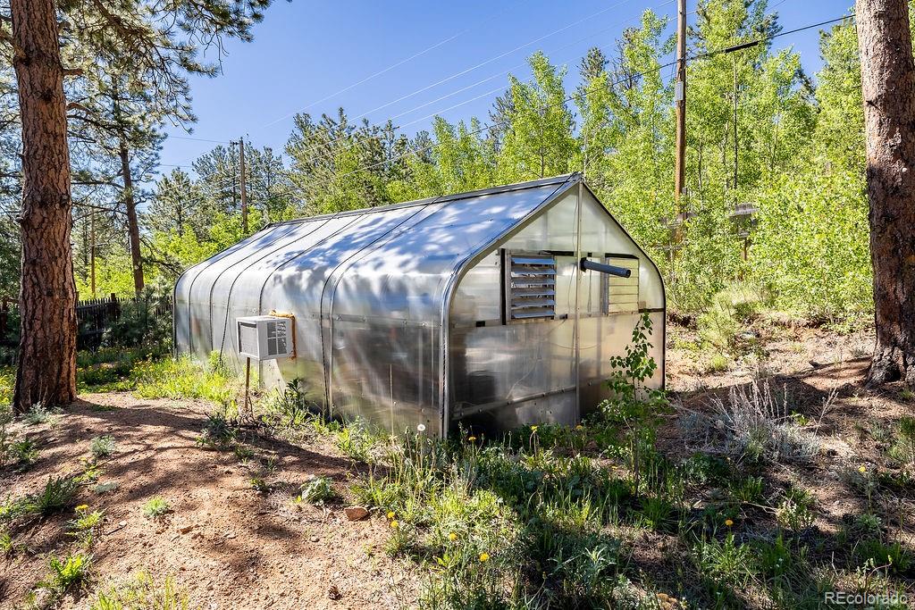 154 Cowan Road Bailey, CO 80421 - Photo 23 of 30 a front view of a house with garden