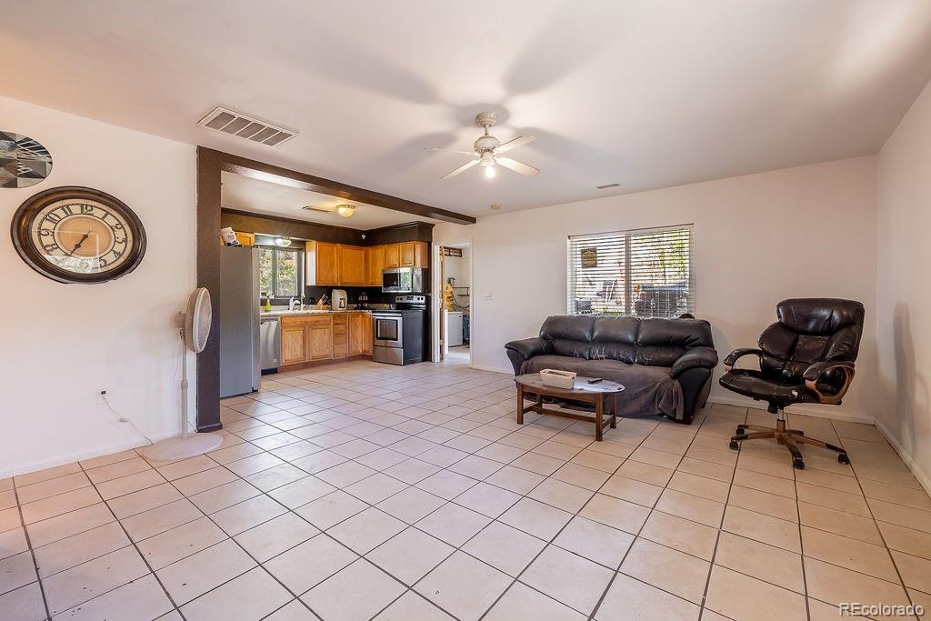 154 Cowan Road Bailey, CO 80421 - Photo 10 of 30 a living room with furniture a clock and a clock