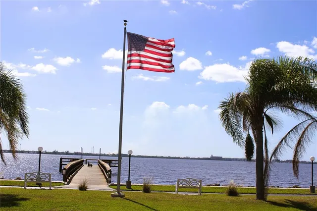 a view of a swimming pool with a table and chairs