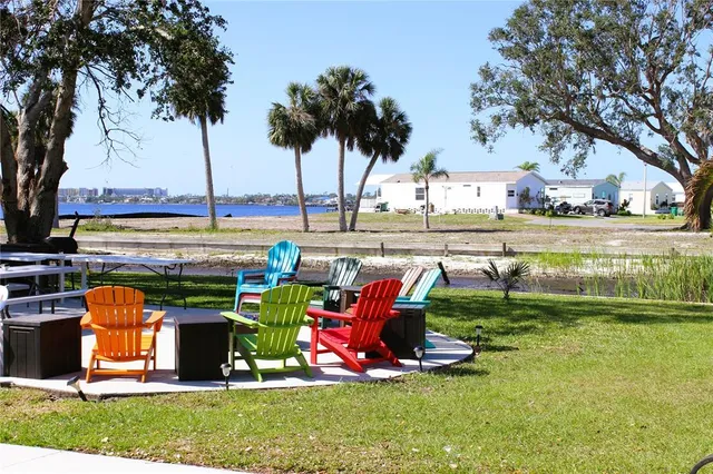 a view of a chairs and table in the patio