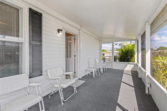 a kitchen with a sink a refrigerator and cabinets
