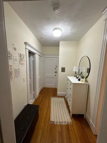 a room with a sink and wooden floor