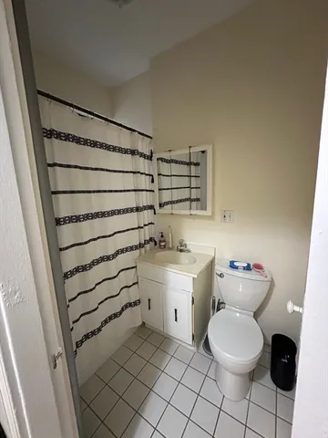a bathroom with a sink toilet and tub
