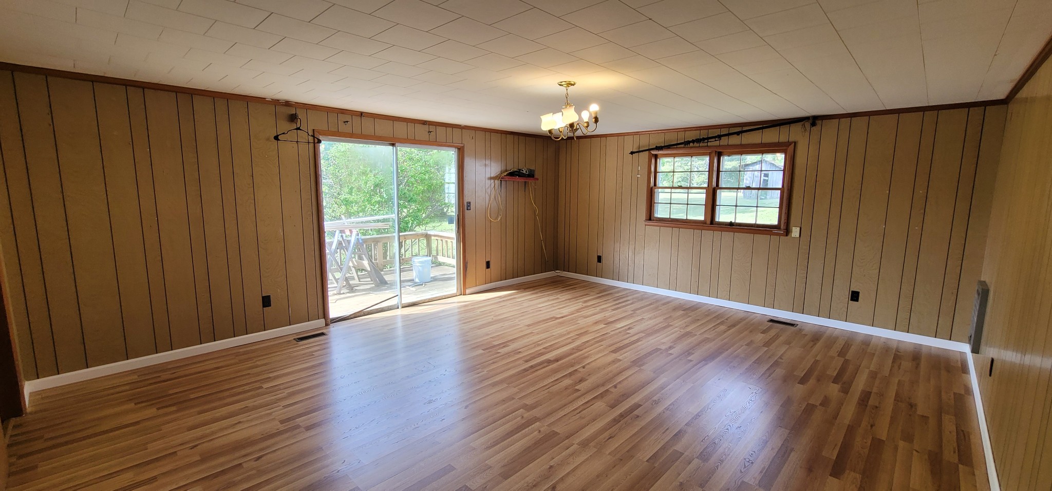 19 Turkey Scratch Road Spencer, TN 38585 - Photo 14 of 27 an empty room with wooden floor and windows