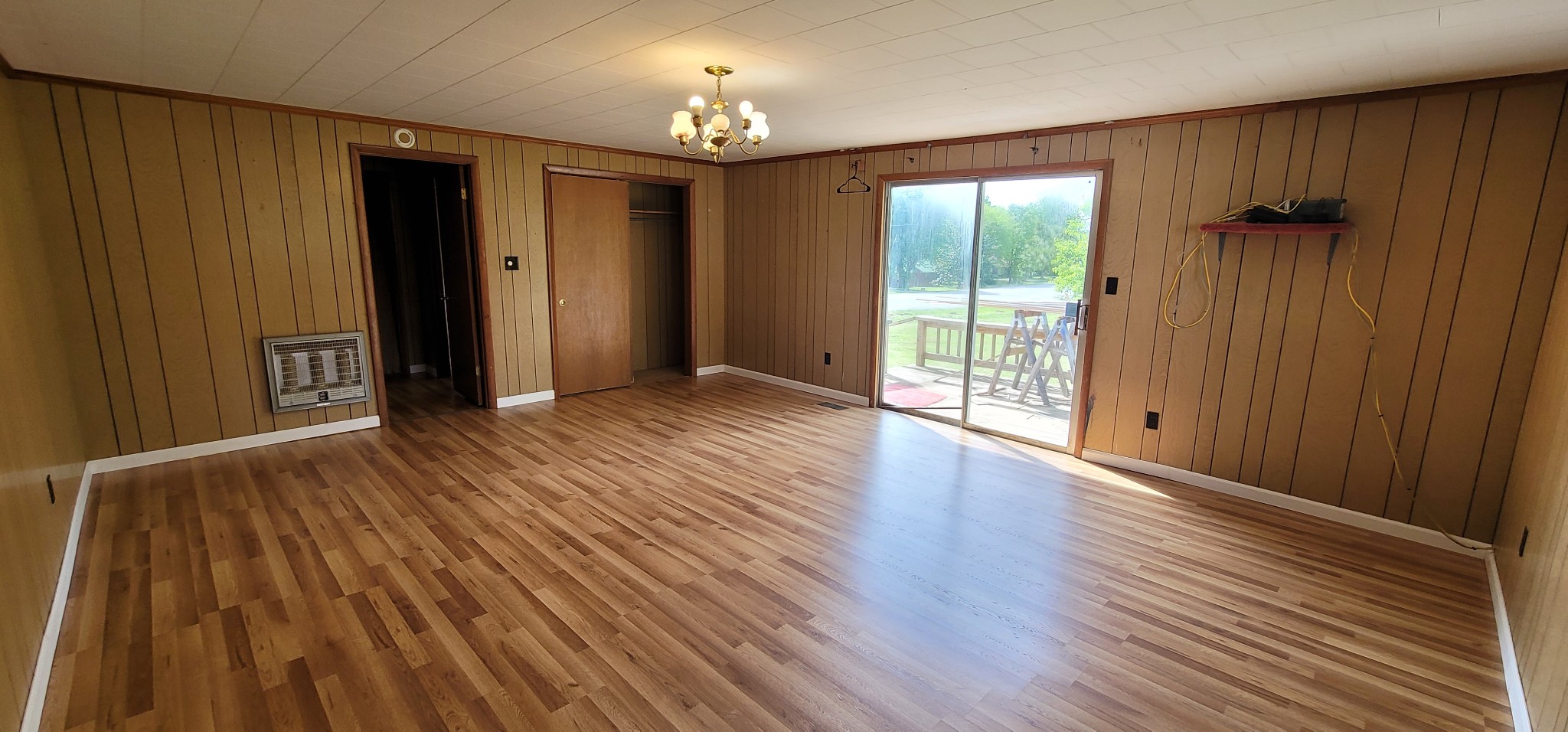 19 Turkey Scratch Road Spencer, TN 38585 - Photo 17 of 27 an empty room with wooden floor and windows