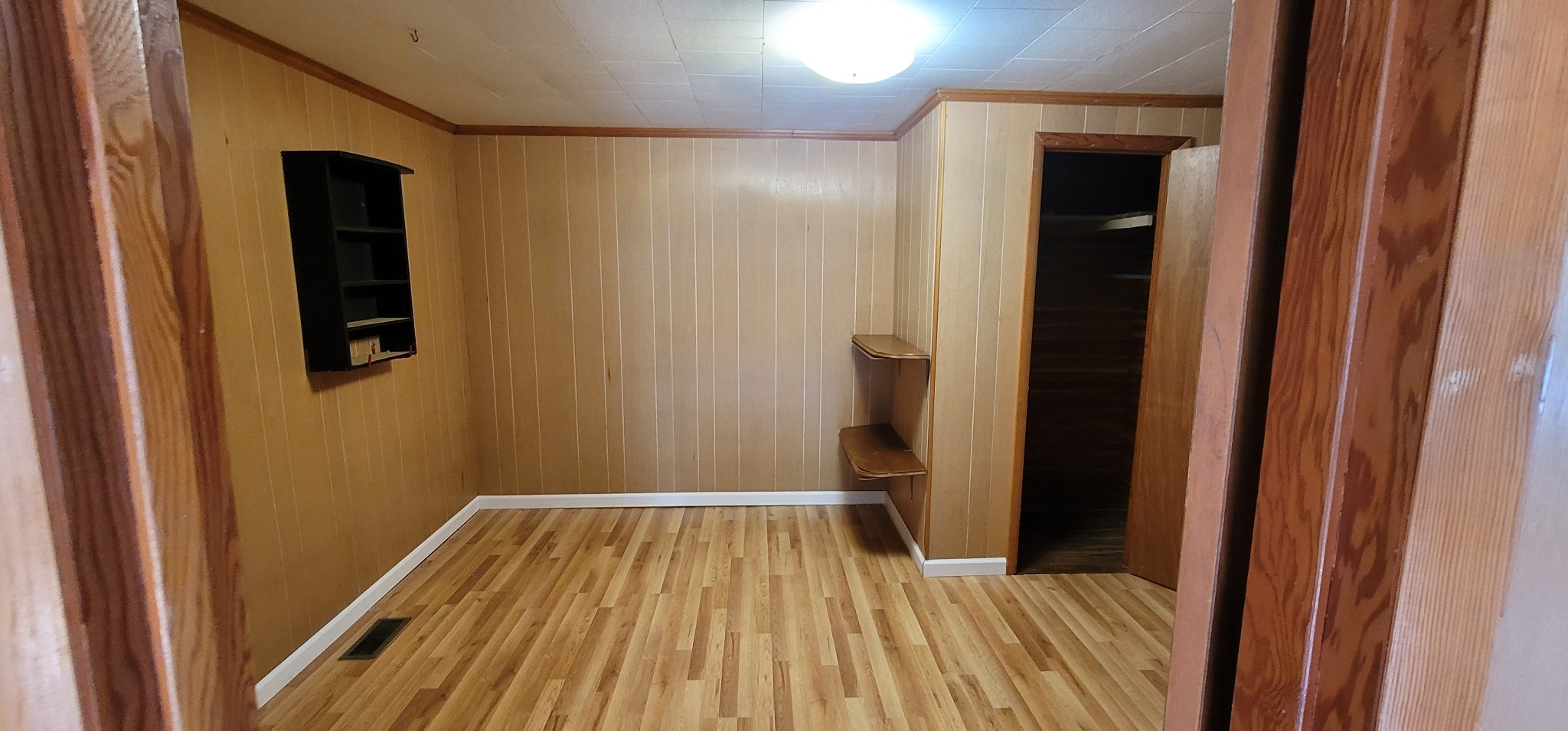 19 Turkey Scratch Road Spencer, TN 38585 - Photo 20 of 27 a view of a room with wooden floor and a bathroom