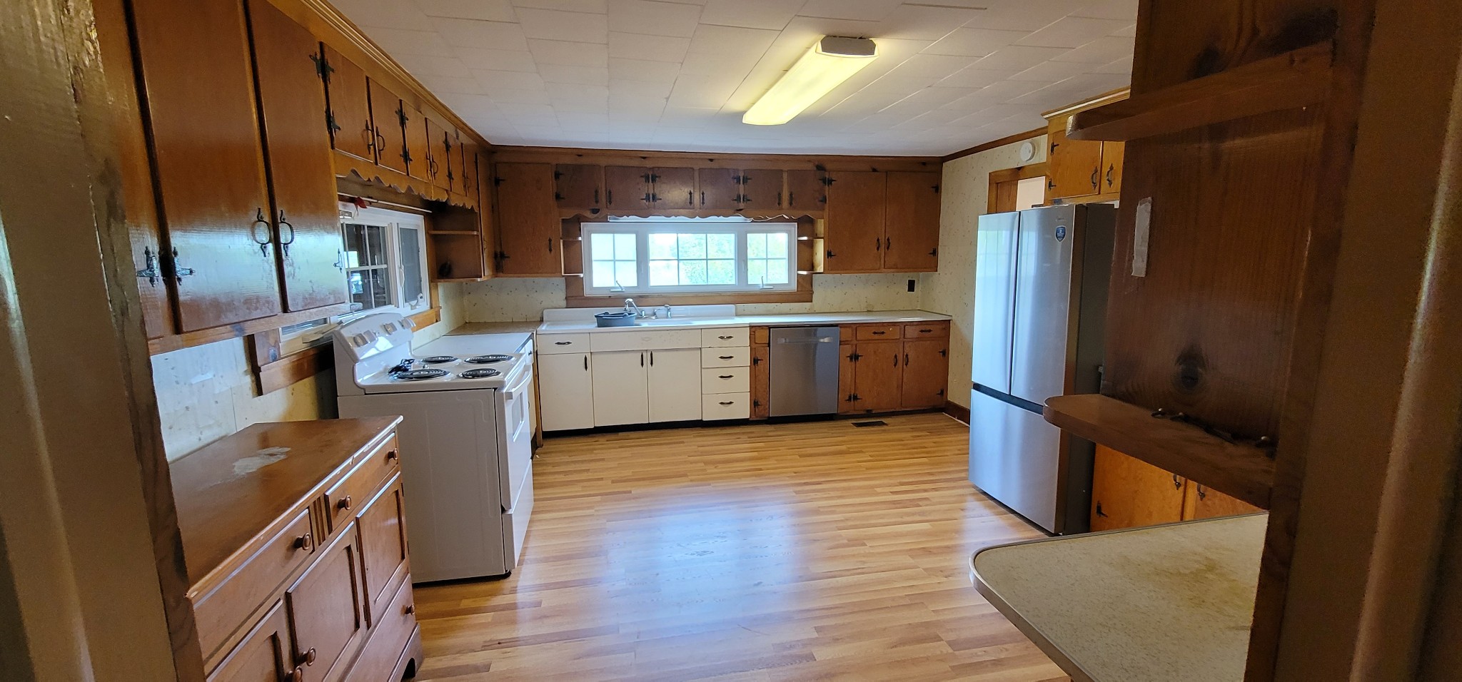 19 Turkey Scratch Road Spencer, TN 38585 - Photo 7 of 27 a kitchen with stainless steel appliances granite countertop a refrigerator a stove top oven a sink and dishwasher
