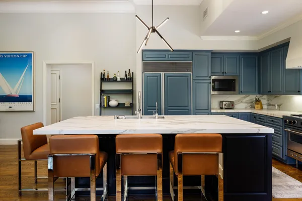 a kitchen with a table and chairs in it