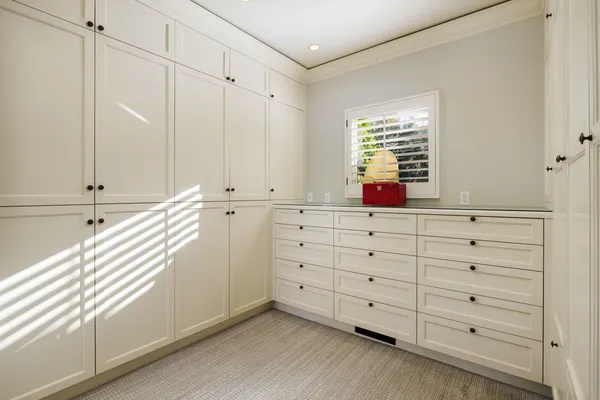 a kitchen with a cabinets and a window