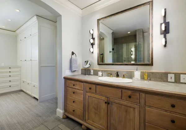 a bathroom with a double vanity sink and mirror
