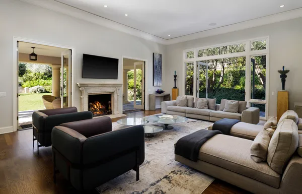 a living room with furniture flat screen tv and a fireplace