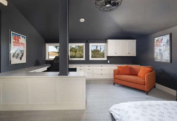 a living room with furniture window and a large window