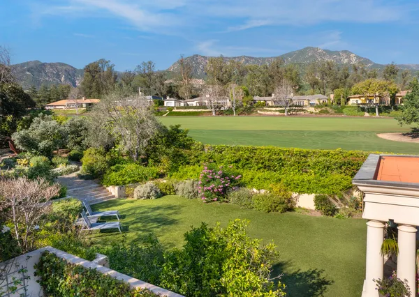 a view of a town with mountains in the background