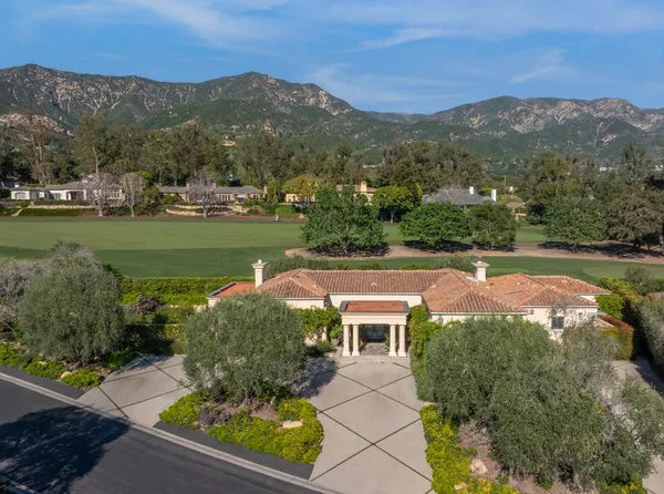 an aerial view of a house with a garden