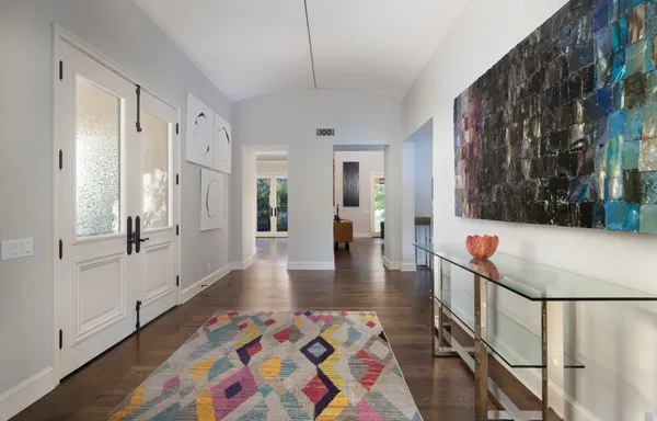 a hallway with table and chairs