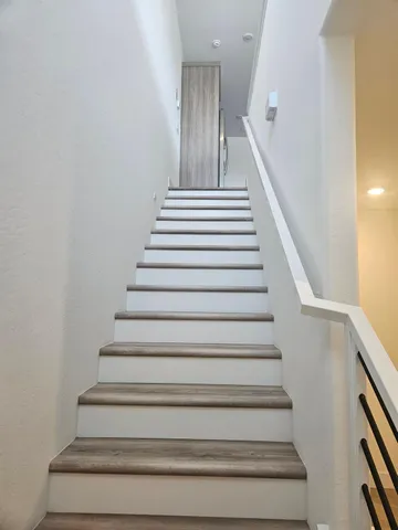 a view of kitchen with wooden floor and window