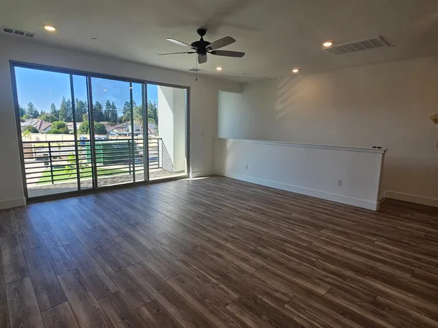 a kitchen with stainless steel appliances granite countertop a refrigerator stove and microwave