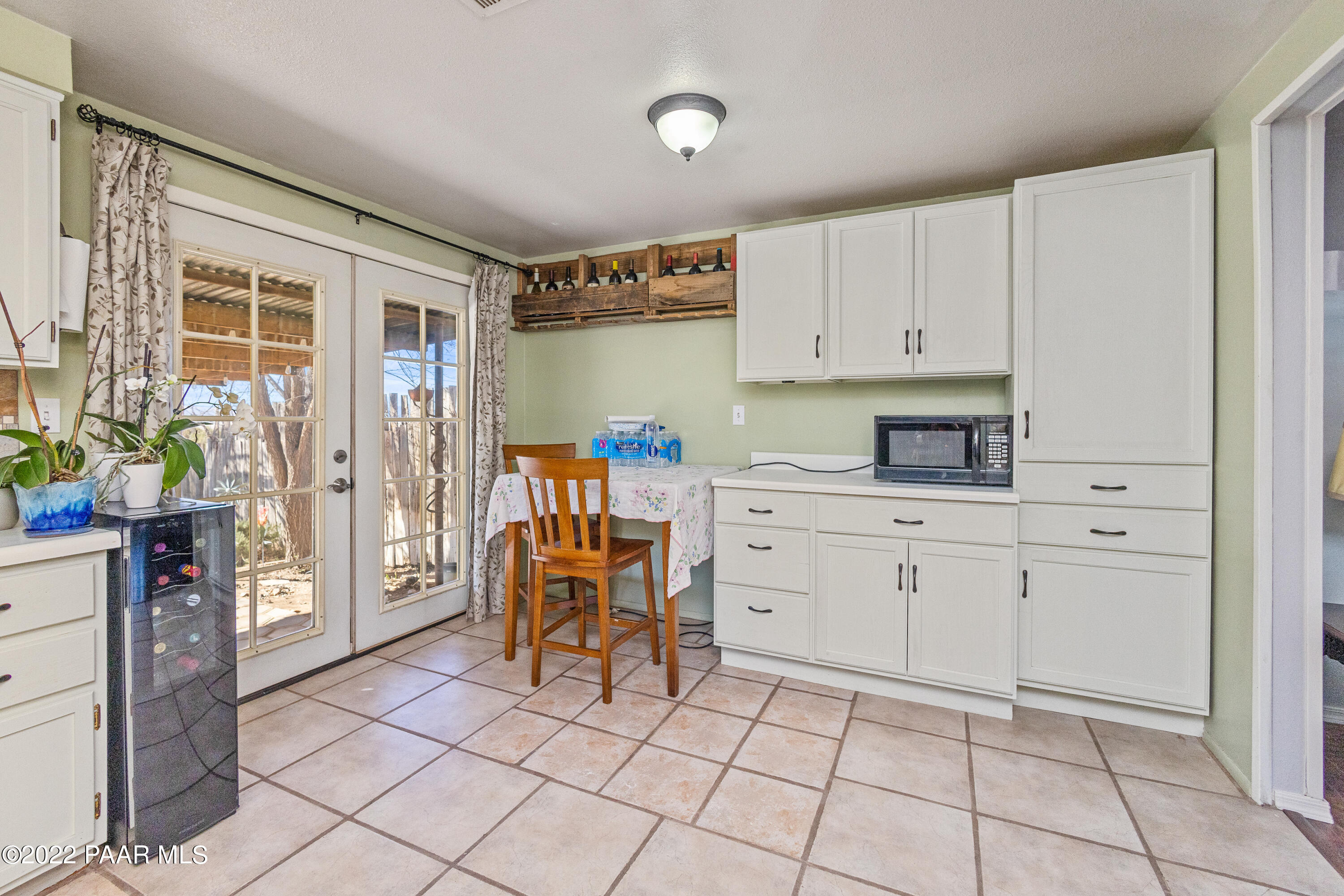 463 Antelope Run Road Paulden, AZ 86334 - Photo 11 of 26 a kitchen with white cabinets and appliances