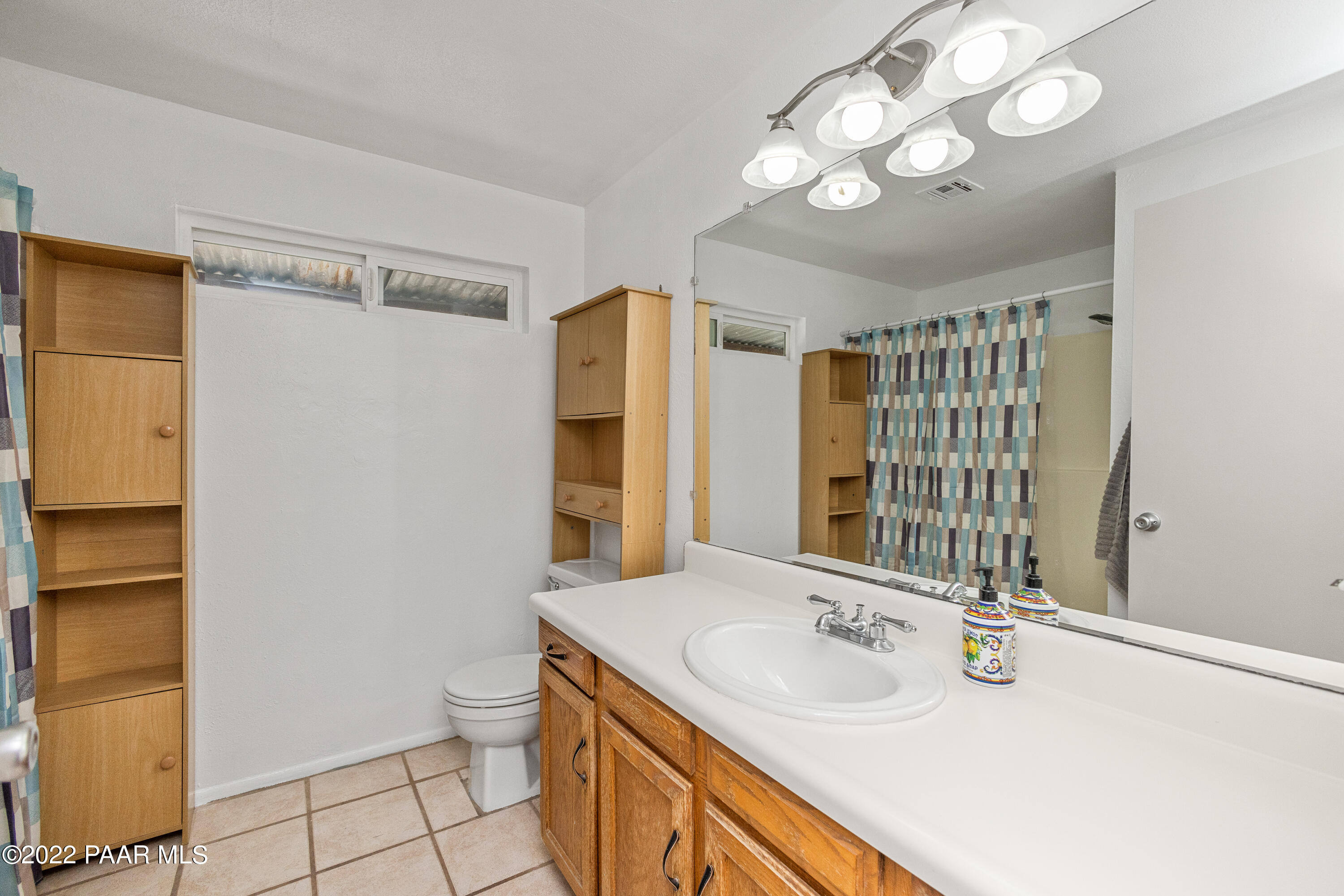463 Antelope Run Road Paulden, AZ 86334 - Photo 12 of 26 a bathroom with a sink a toilet and a mirror