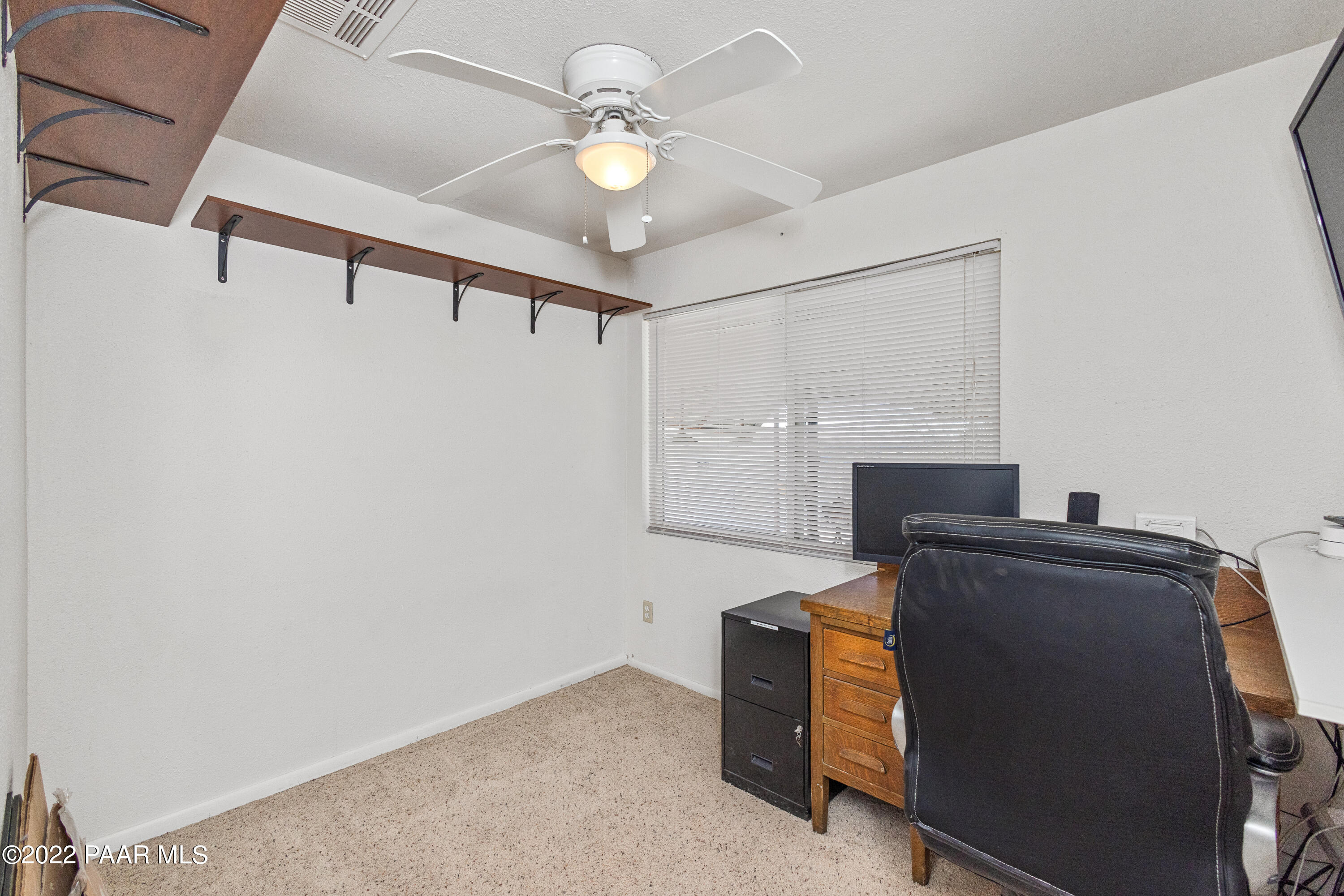 463 Antelope Run Road Paulden, AZ 86334 - Photo 15 of 26 a living room with furniture and a fireplace