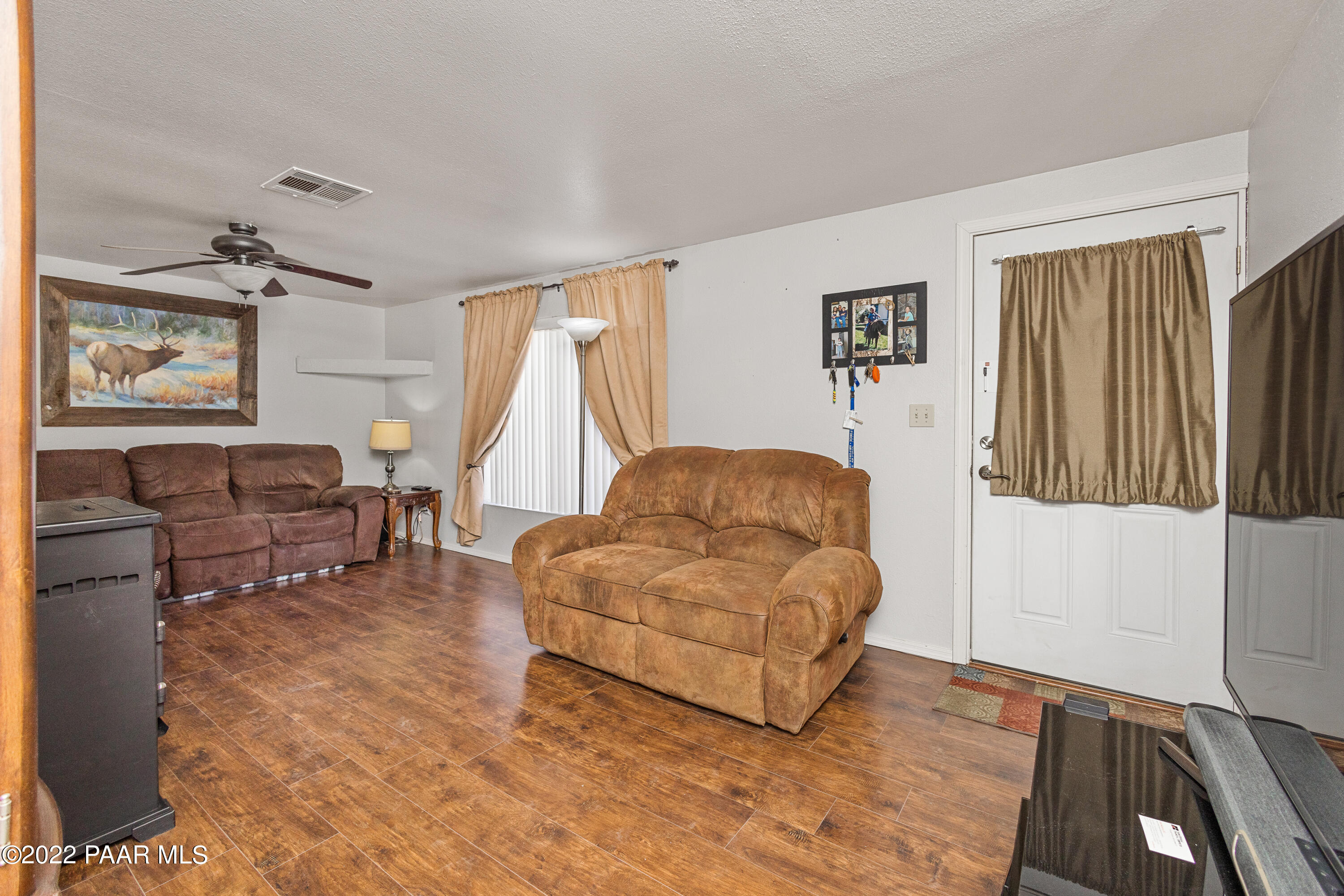 463 Antelope Run Road Paulden, AZ 86334 - Photo 6 of 26 a living room with furniture and a flat screen tv