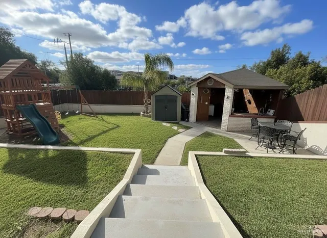 a view of a house with swimming pool and sitting area