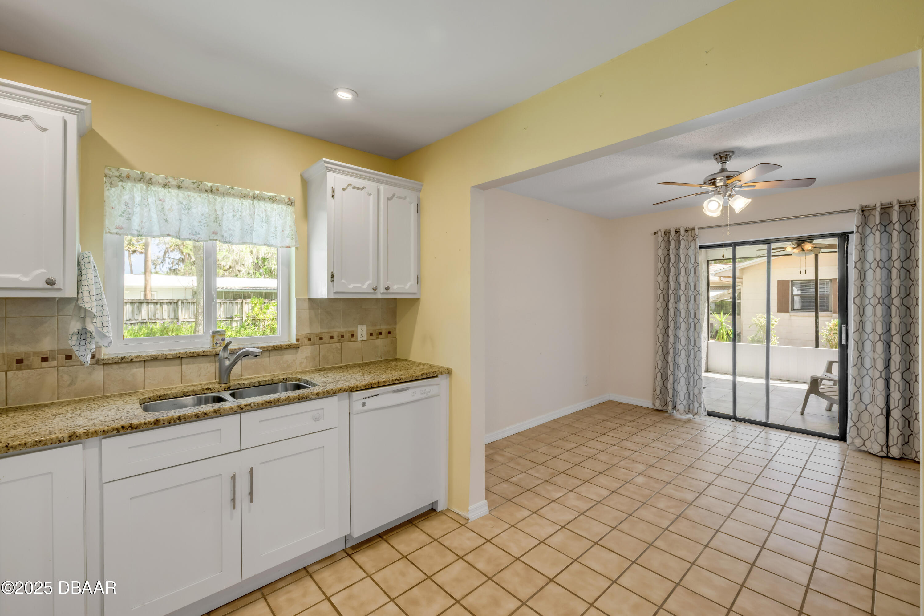 1851 Pine Tree Drive Edgewater, FL 32141 - Photo 11 of 29 a kitchen with a sink and cabinets