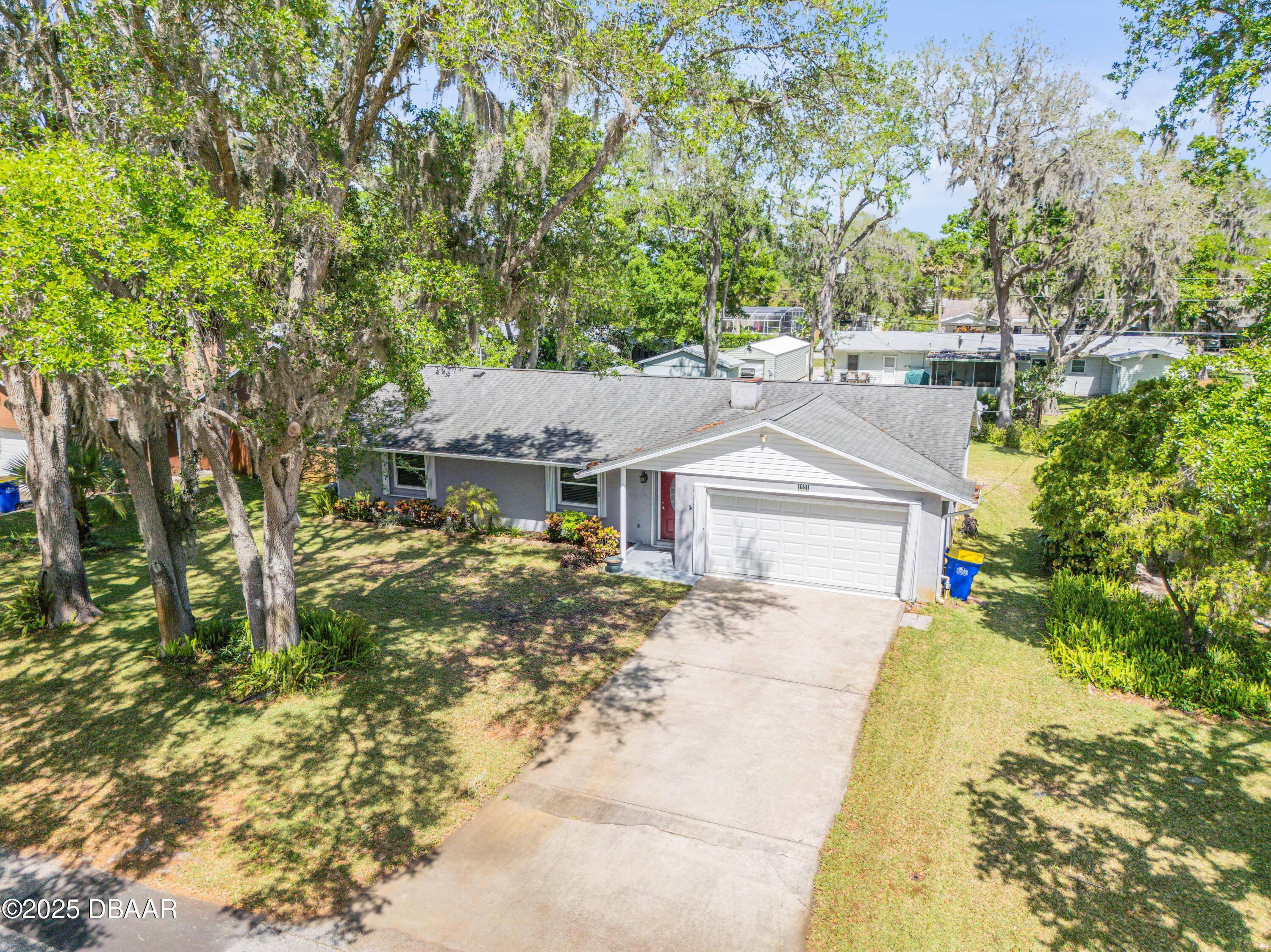 1851 Pine Tree Drive Edgewater, FL 32141 - Photo 21 of 29 front view of a house with a yard
