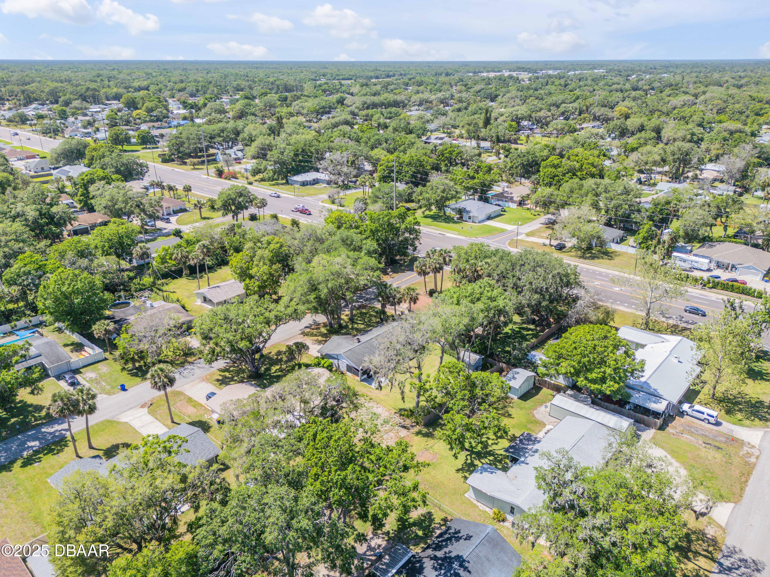 1851 Pine Tree Drive Edgewater, FL 32141 - Photo 24 of 29 a view of a city with green field