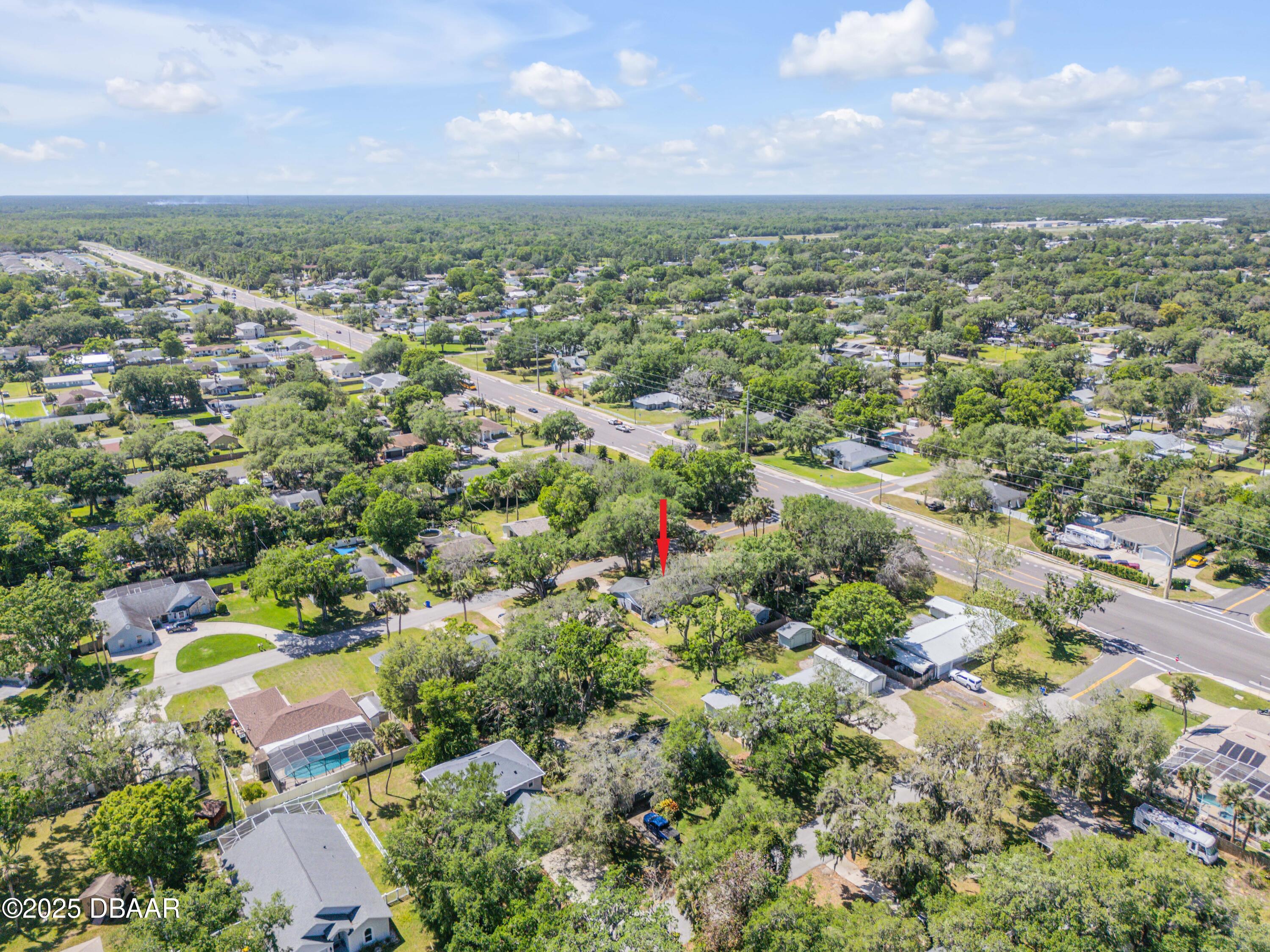 1851 Pine Tree Drive Edgewater, FL 32141 - Photo 25 of 29 an aerial view of residential houses with outdoor space and trees