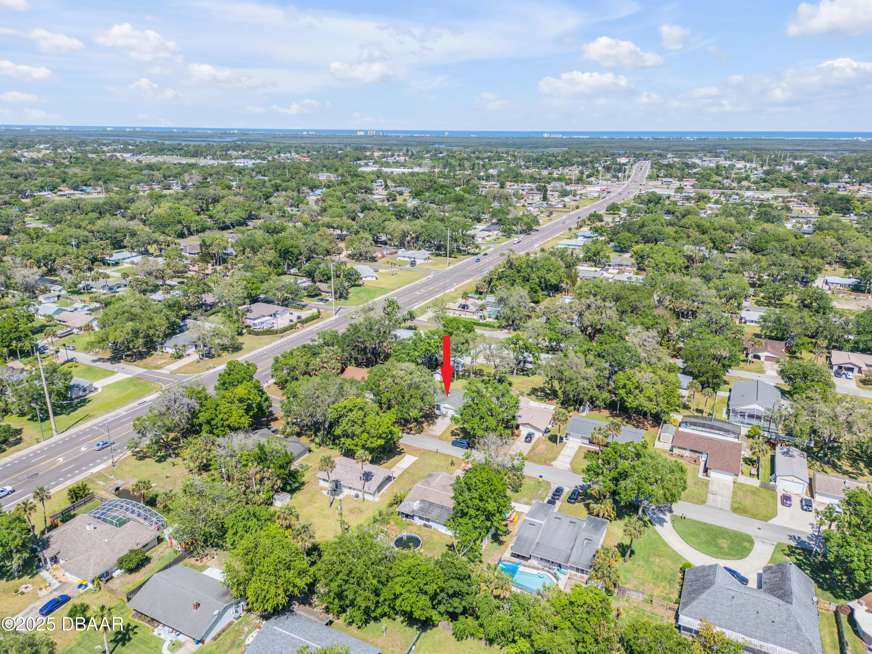 1851 Pine Tree Drive Edgewater, FL 32141 - Photo 26 of 29 an aerial view of residential houses with outdoor space and trees