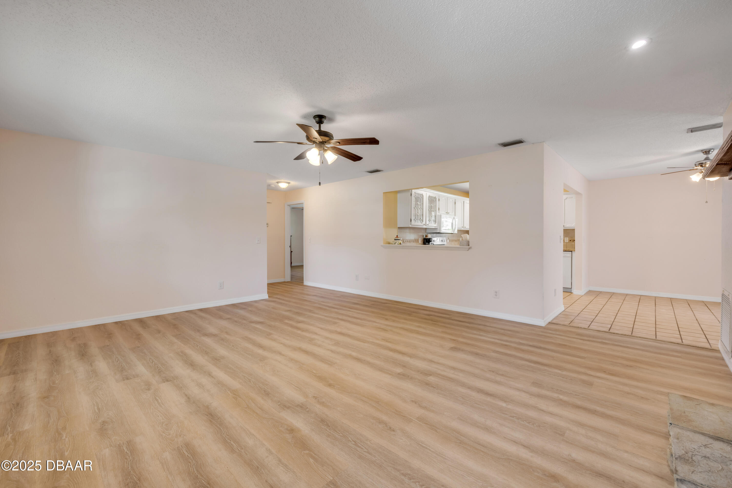 1851 Pine Tree Drive Edgewater, FL 32141 - Photo 4 of 29 a view of empty room with wooden floor