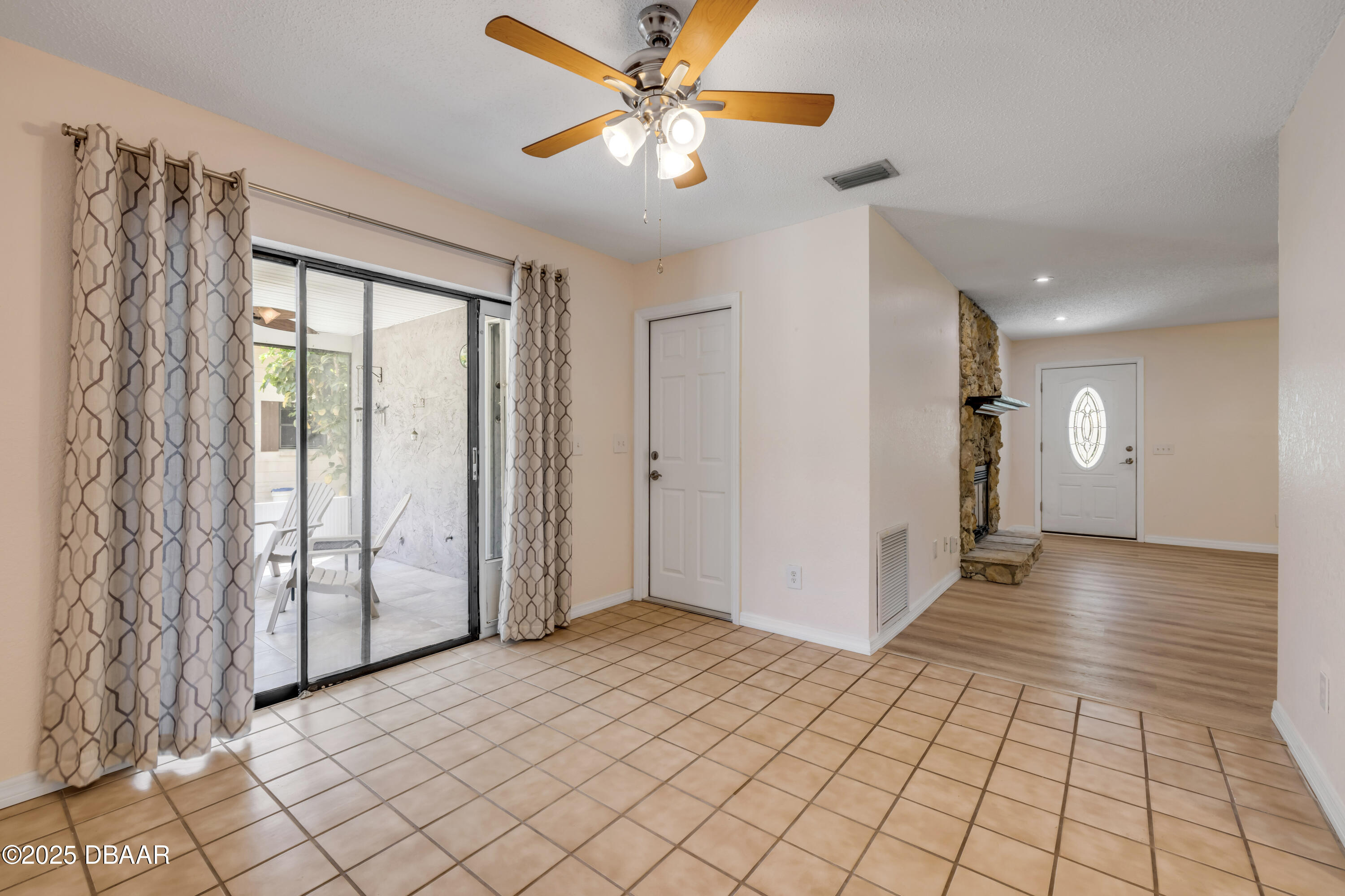 1851 Pine Tree Drive Edgewater, FL 32141 - Photo 6 of 29 a view of a livingroom with a chandelier fan and windows