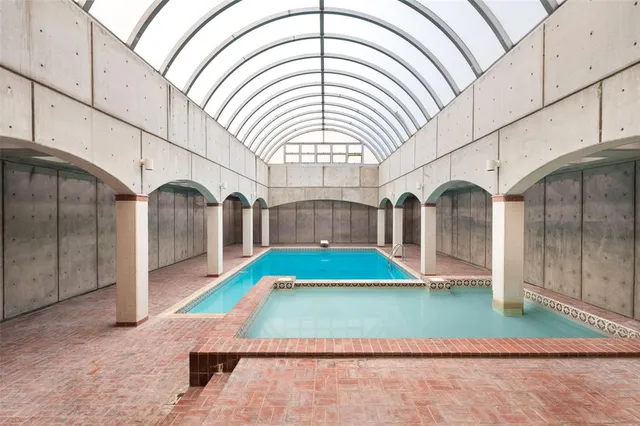 a view of a kitchen with wooden floor and a sink