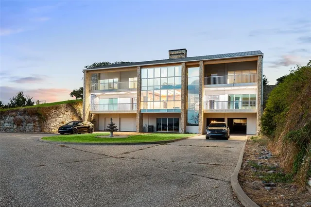 a view of a bench with wooden fence