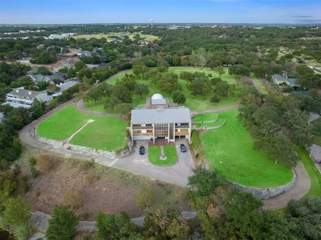 a view of a house with a backyard porch and sitting area