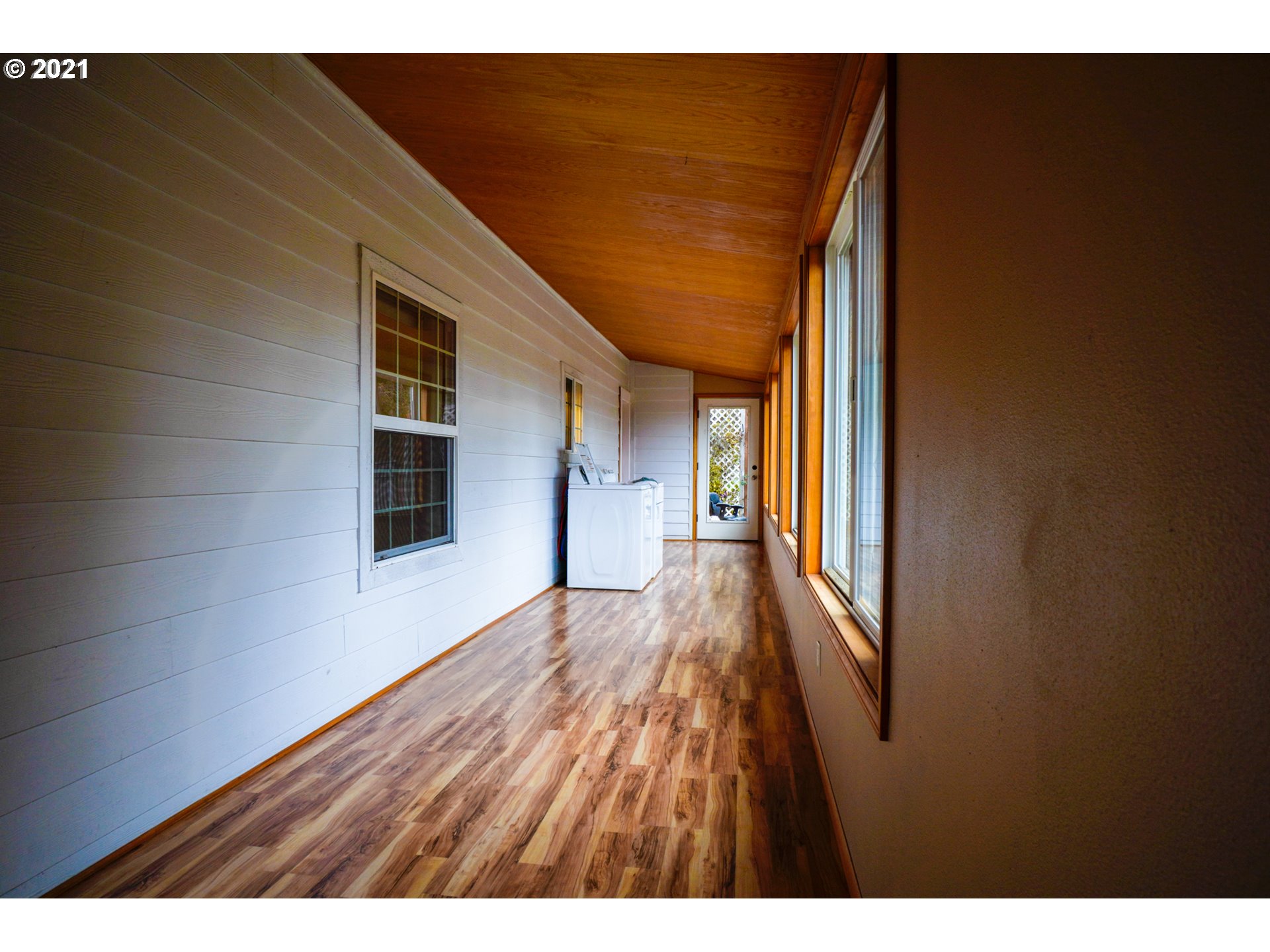 1579 South Side Road Sutherlin, OR 97479 - Photo 14 of 31 a view of a hallway with wooden floor and staircase