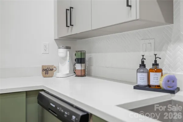 a kitchen with a sink and cabinets