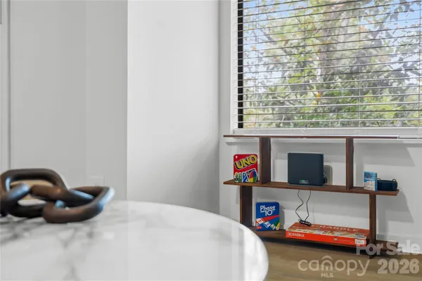 a bedroom with furniture and a window