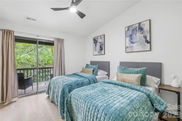 a bedroom with a large bed and a window