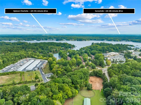 a view of a back yard of a house with a yard