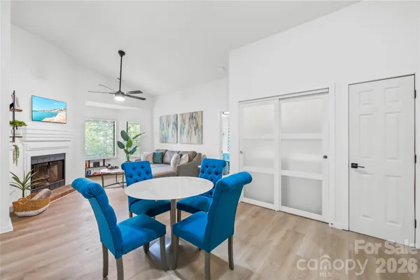 a view of a dining room with furniture window and wooden floor