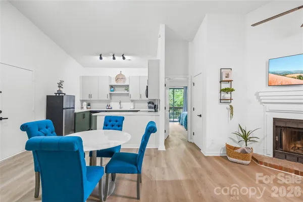 a view of kitchen with furniture and a fireplace