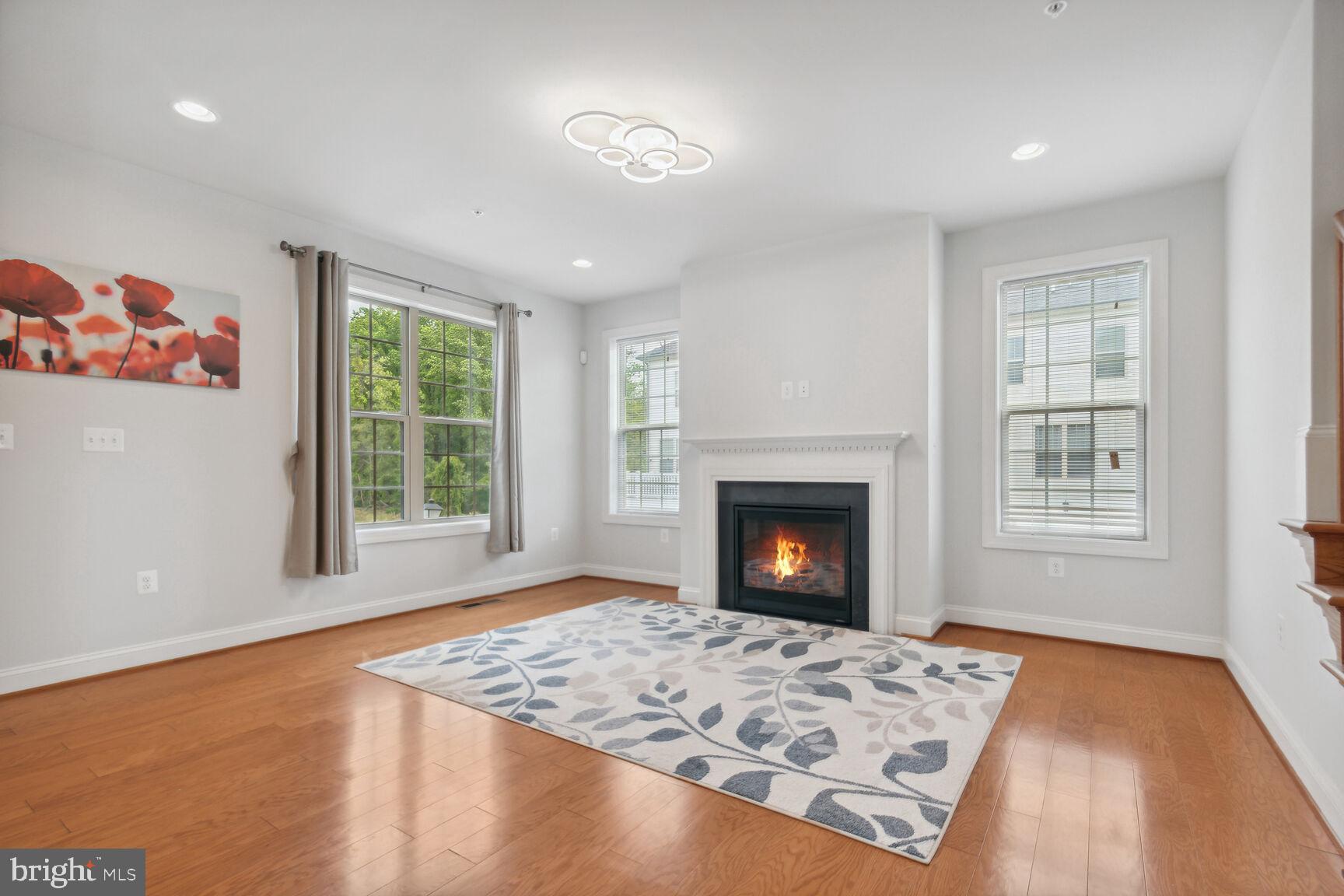 13601 Soaring Wing Lane Silver Spring, MD 20906 - Photo 11 of 53 a view of a livingroom with a fireplace and window