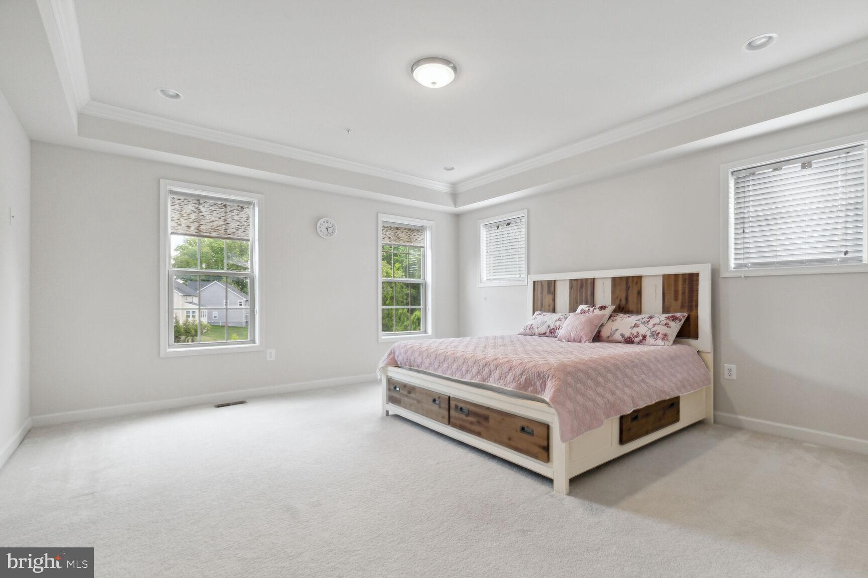 13601 Soaring Wing Lane Silver Spring, MD 20906 - Photo 14 of 53 a bedroom with a bed lamp and window