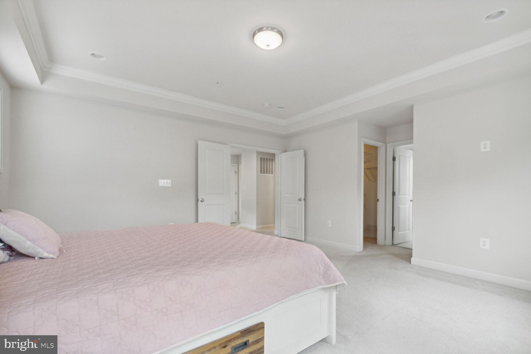 13601 Soaring Wing Lane Silver Spring, MD 20906 - Photo 16 of 53 a bedroom with a bed and a night stand